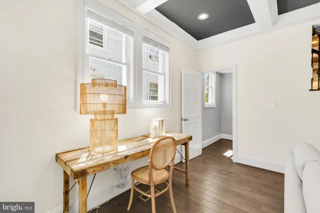 a kitchen with stainless steel appliances kitchen island granite countertop a sink a stove and a refrigerator