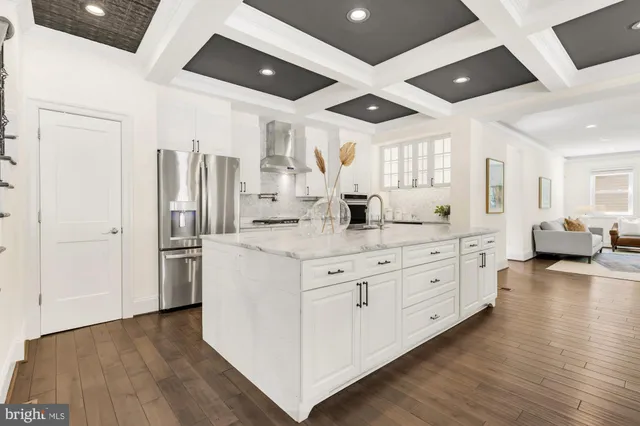 a kitchen with sink and cabinets