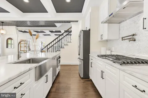 a bathroom with double vanity and a sink