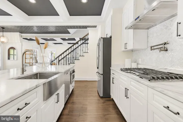 a bathroom with double vanity and a sink