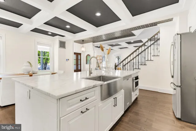 a kitchen with cabinets and a stove top oven