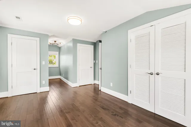 an empty room with wooden floor