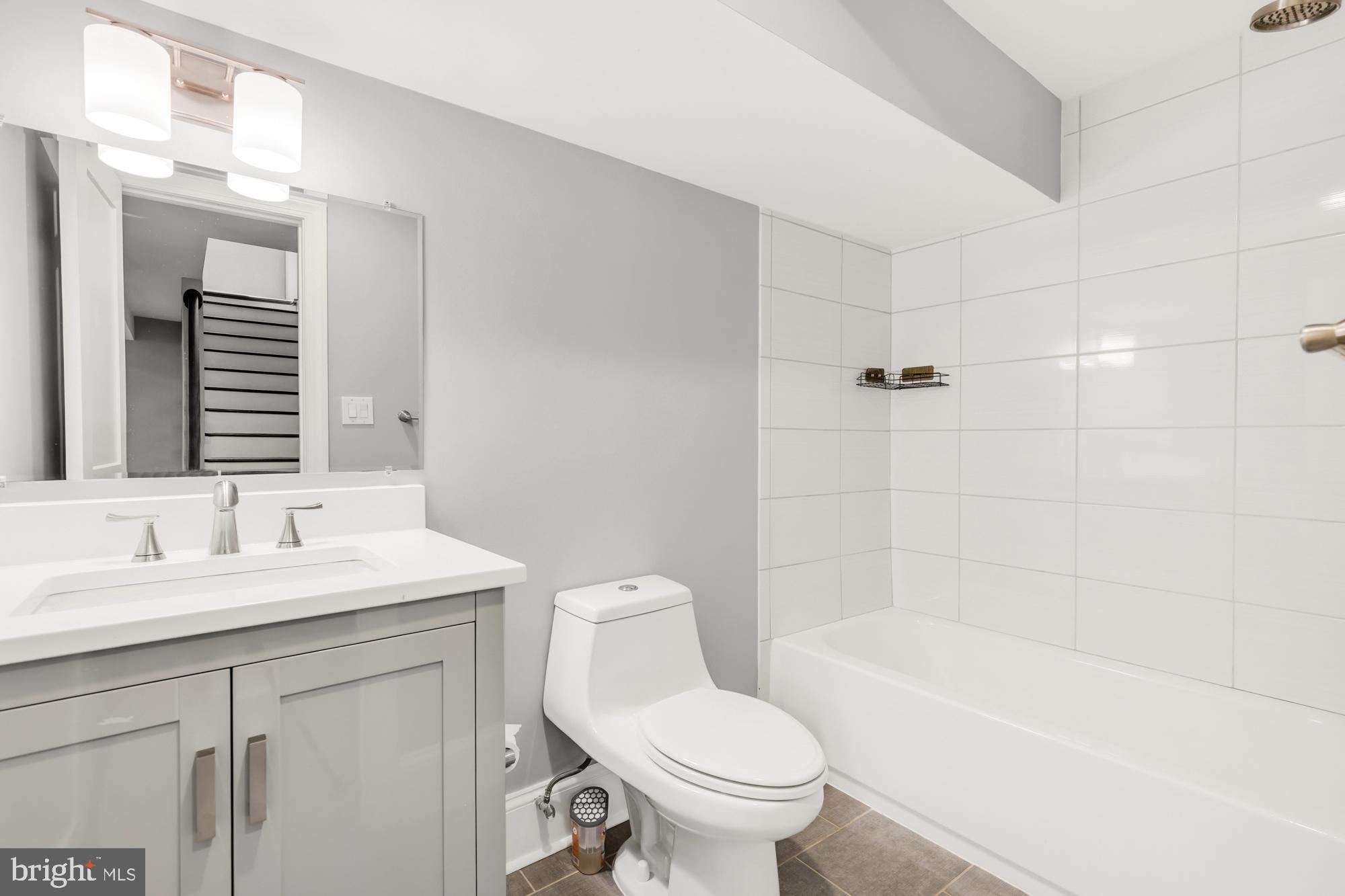 1202 Decatur Street Northwest Washington, DC 20011 - Photo 48 of 53 a bathroom with a sink a toilet and shower