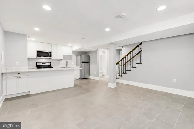 a bathroom with a sink and a window