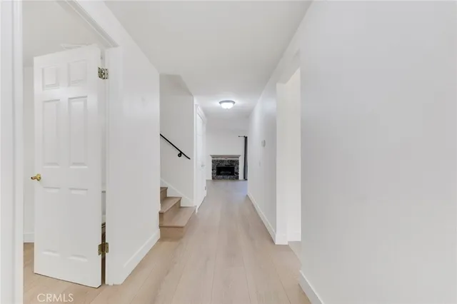 a view of a hallway with white walls