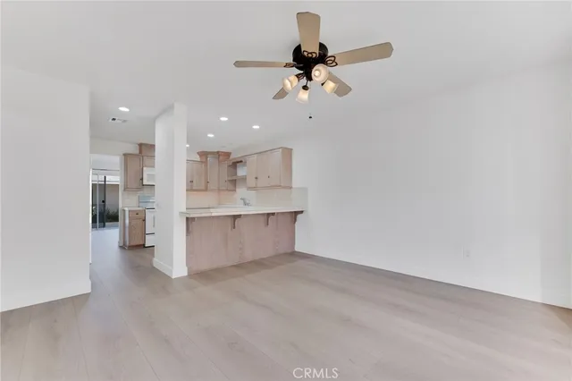 a view of kitchen and kitchen with stainless steel appliances