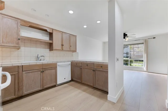 a spacious bathroom with a granite countertop sink and a vanity