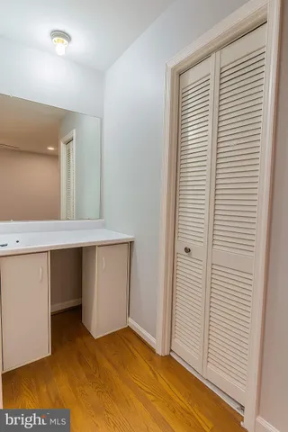 a view of room with a sink and cabinets