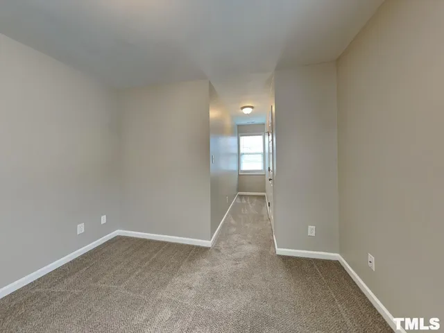 a white toilet sitting next to a bath tub