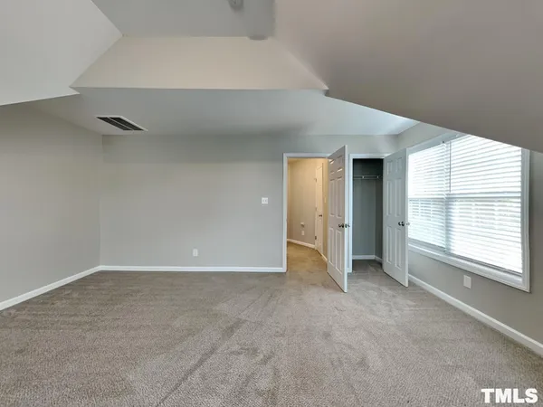 a view of a porch with a floor to ceiling window