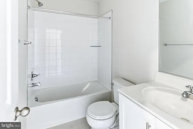 a bathroom with a sink a toilet and a bathtub