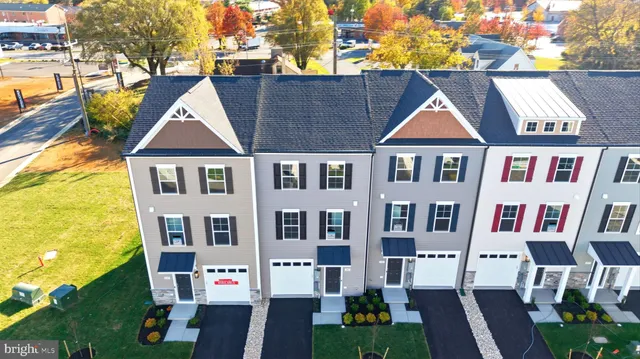 a aerial view of a house with swimming pool
