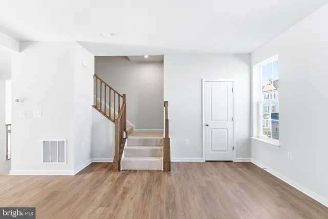 a view of entryway with wooden floor