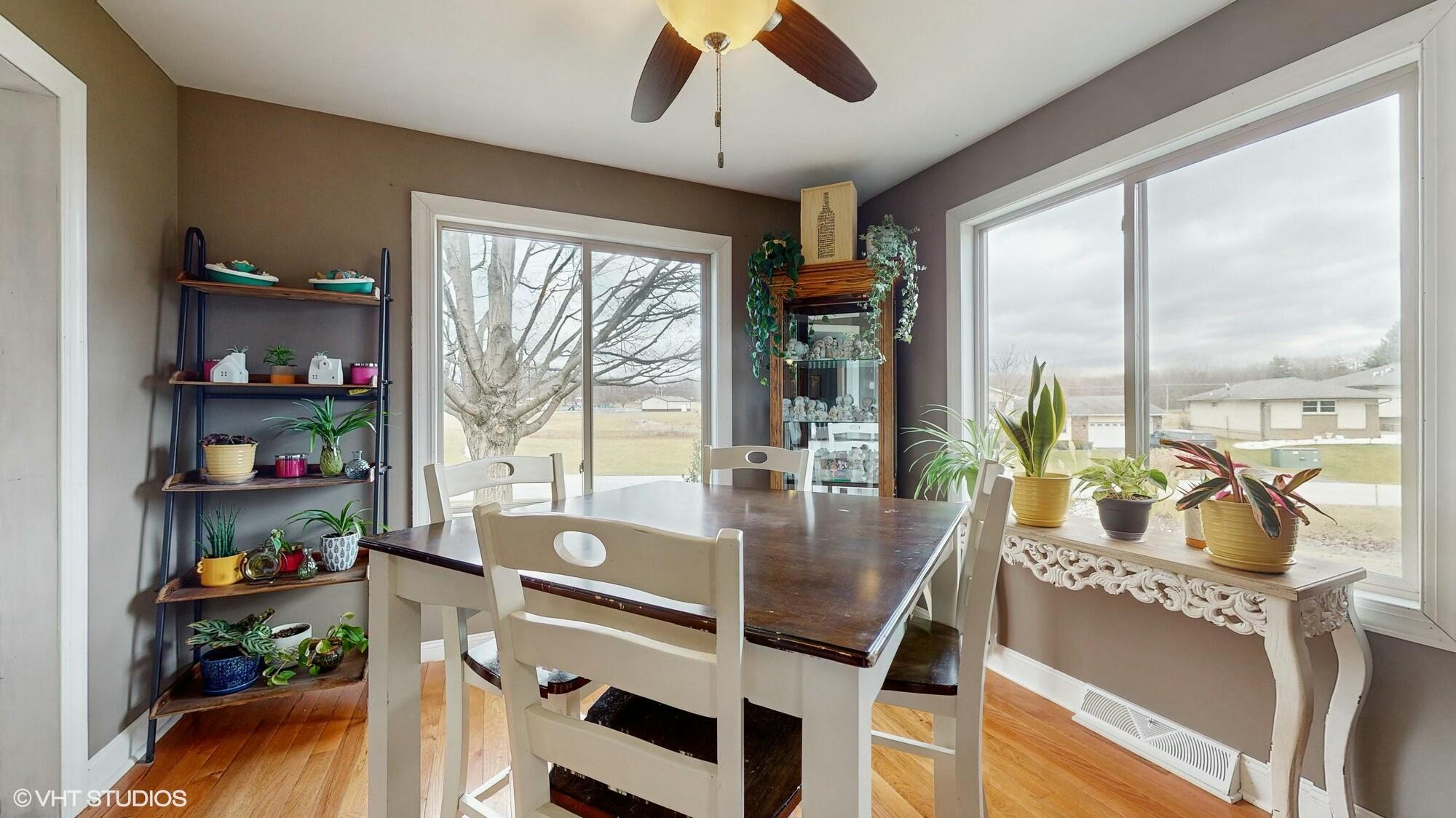 1980 Greenvalley Drive Crown Point, IN 46307 - Photo 11 of 45 a dining room with furniture water view and a floor to ceiling window