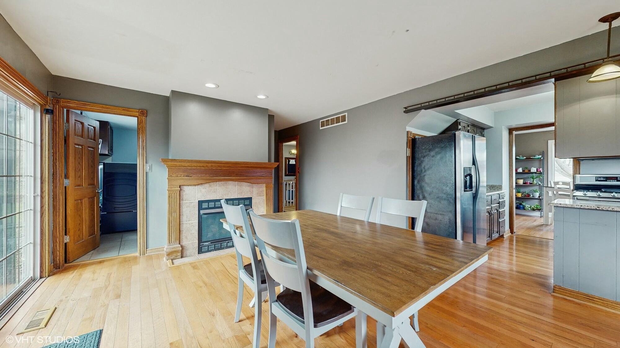 1980 Greenvalley Drive Crown Point, IN 46307 - Photo 15 of 45 a dining room with furniture and wooden floor