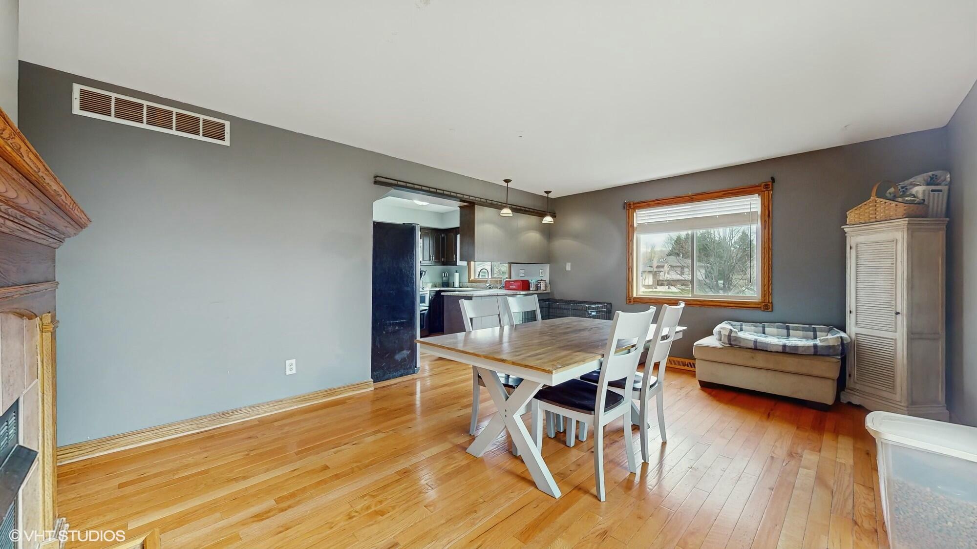 1980 Greenvalley Drive Crown Point, IN 46307 - Photo 16 of 45 a dining room with furniture and wooden floor