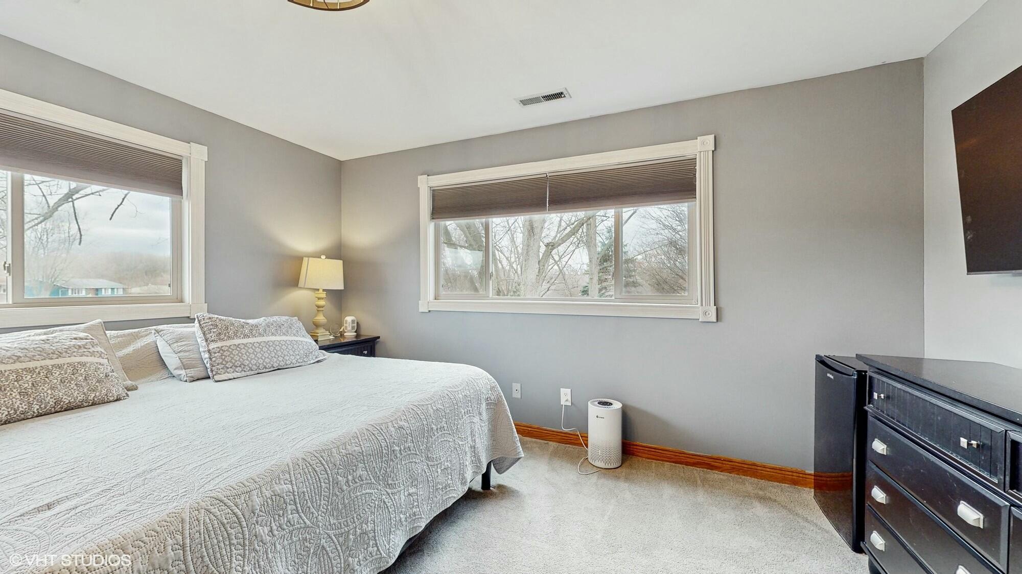 1980 Greenvalley Drive Crown Point, IN 46307 - Photo 19 of 45 a bedroom with a bed and a window