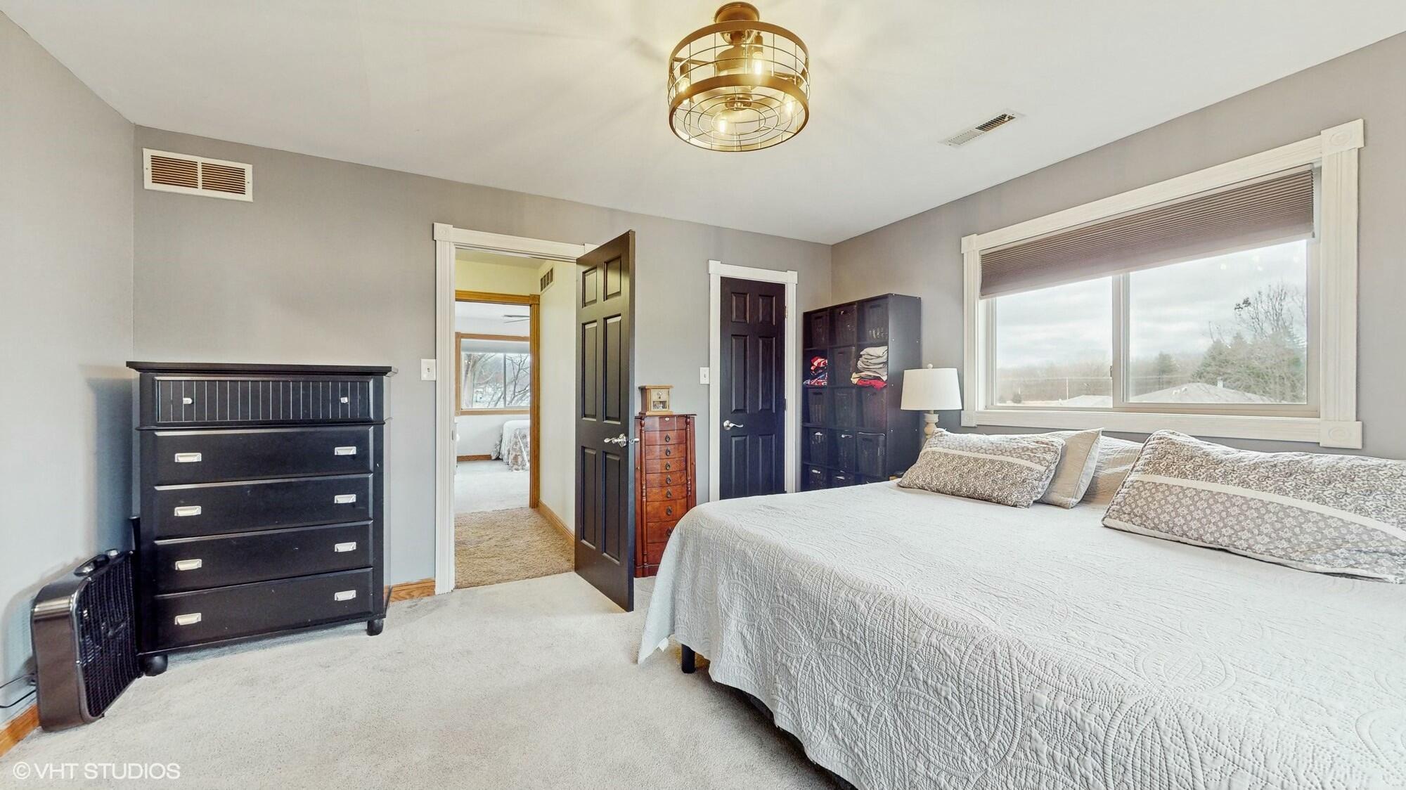 1980 Greenvalley Drive Crown Point, IN 46307 - Photo 20 of 45 a bedroom with a bed and a dresser