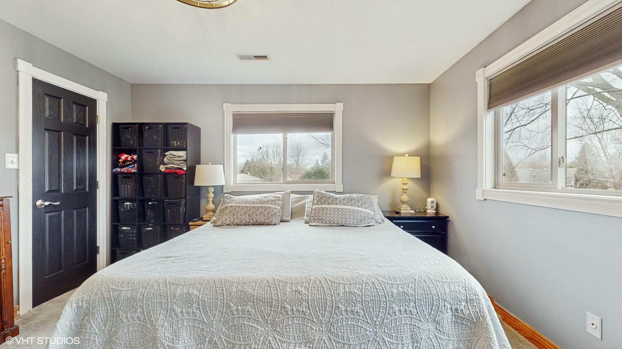 1980 Greenvalley Drive Crown Point, IN 46307 - Photo 21 of 45 a bedroom with a bed and a large window