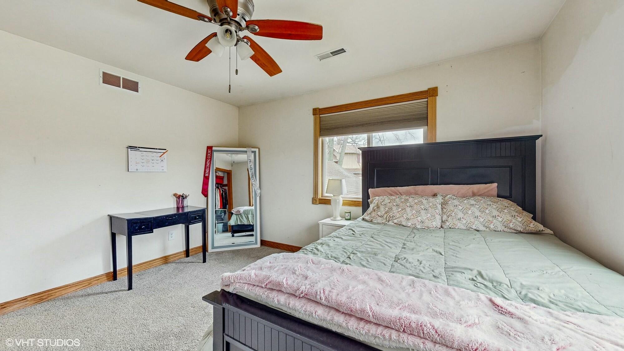 1980 Greenvalley Drive Crown Point, IN 46307 - Photo 26 of 45 a bedroom with a bed and a chandelier
