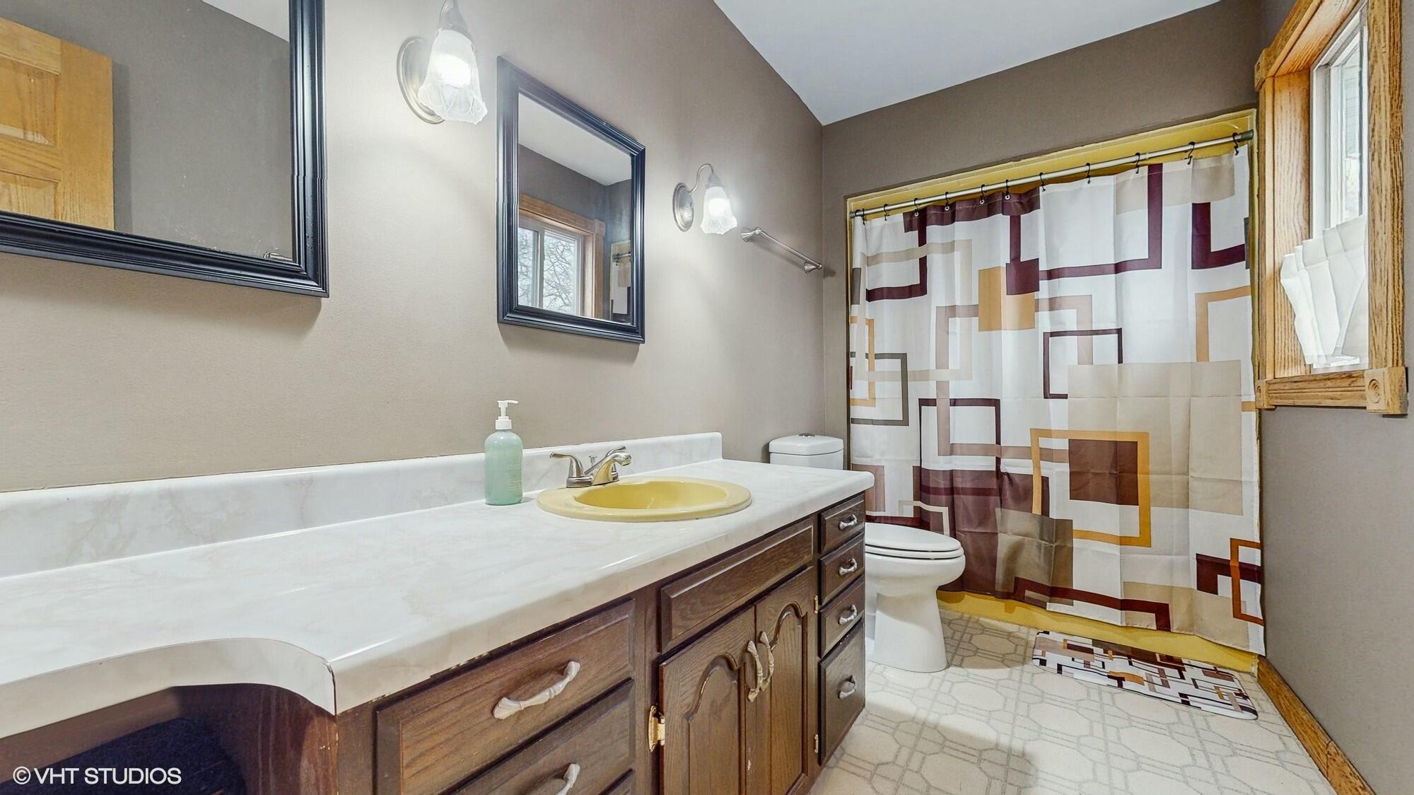 1980 Greenvalley Drive Crown Point, IN 46307 - Photo 27 of 45 a bathroom with a sink a vanity and a mirror
