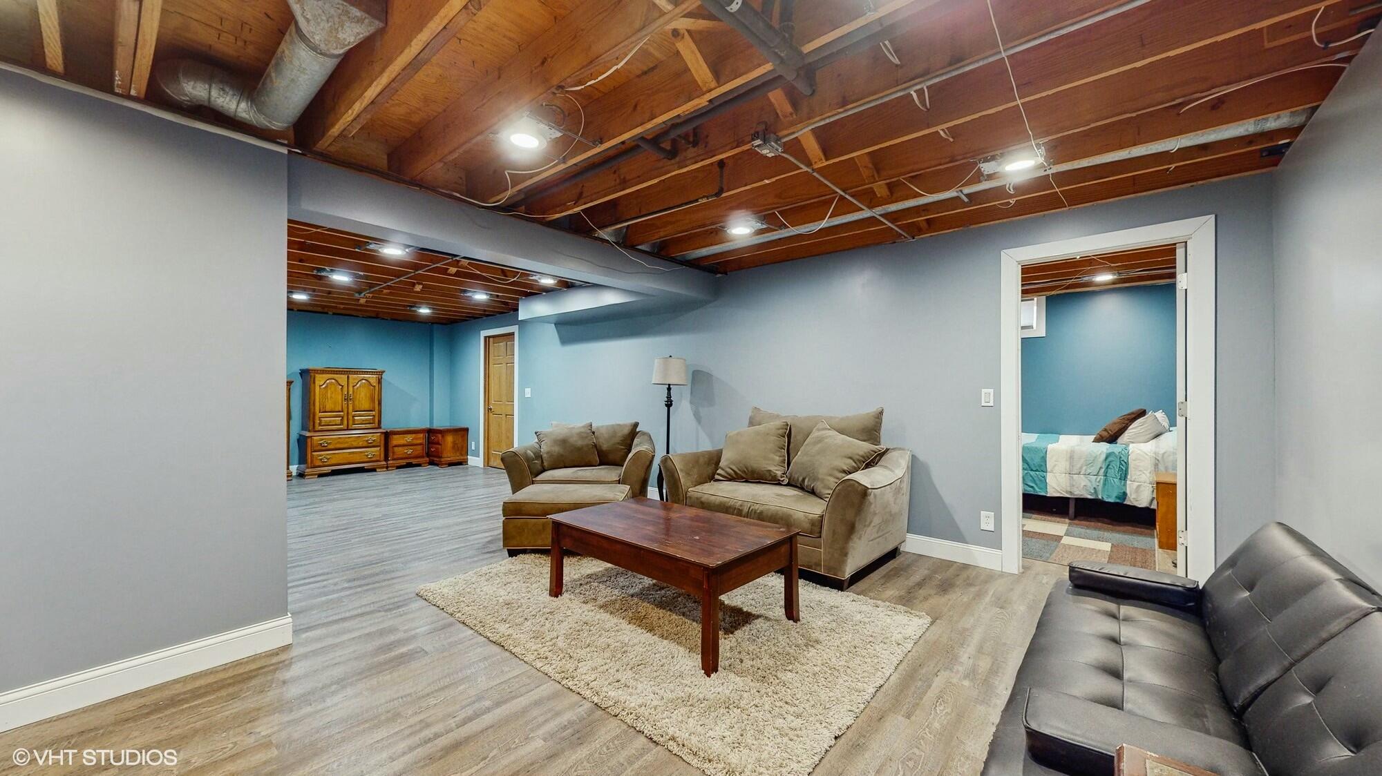 1980 Greenvalley Drive Crown Point, IN 46307 - Photo 28 of 45 a living room with furniture and a wooden floor