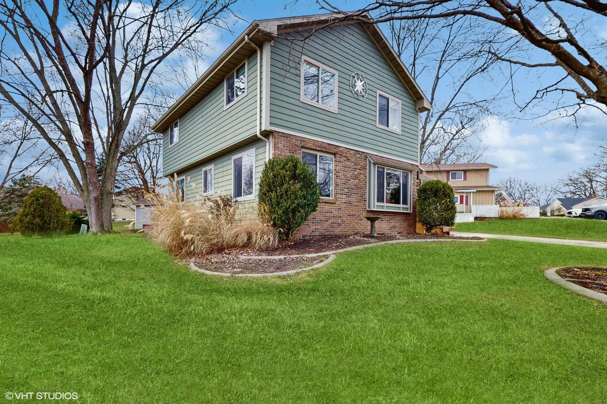 1980 Greenvalley Drive Crown Point, IN 46307 - Photo 3 of 45 a front view of house with a garden
