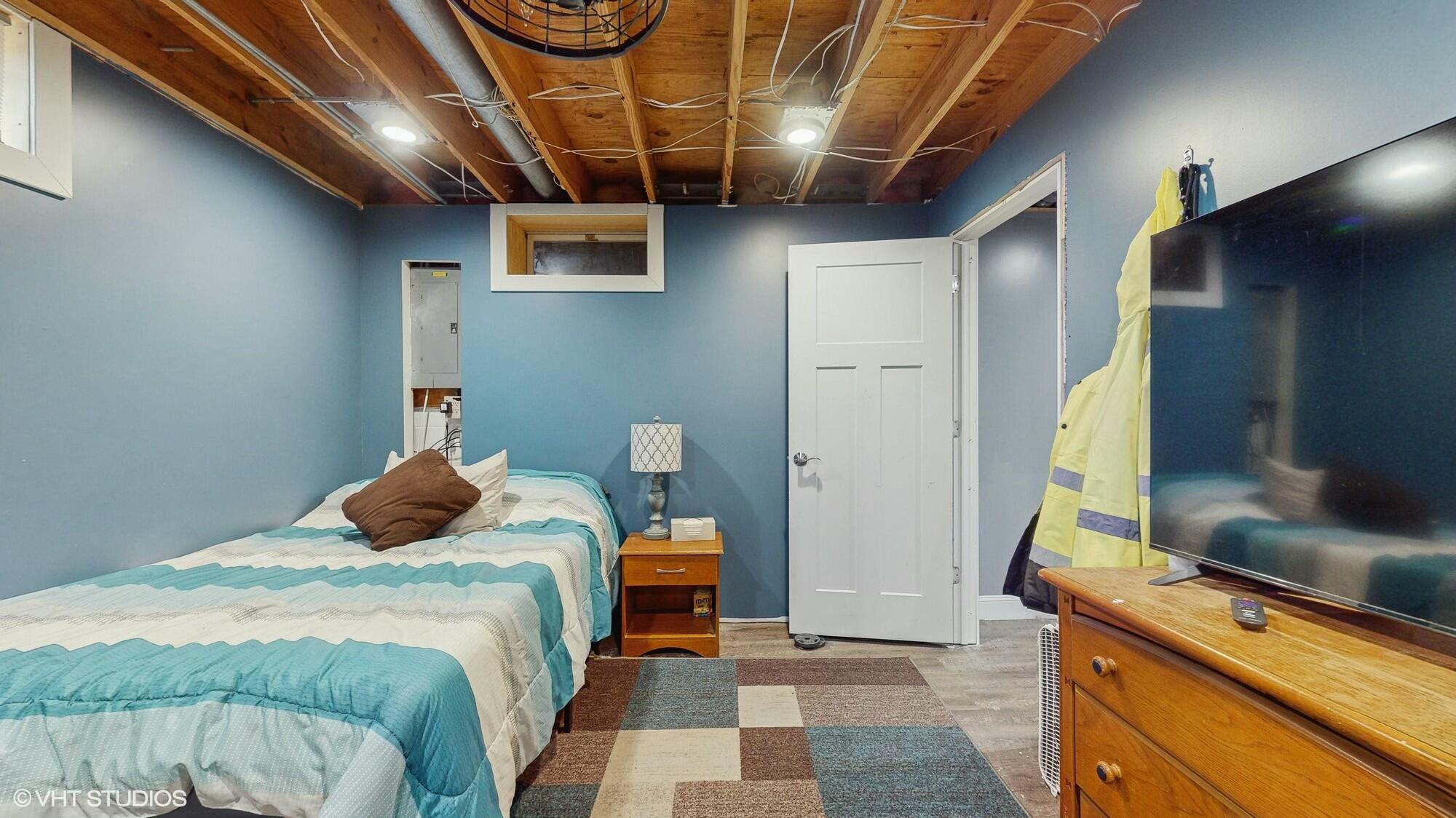 1980 Greenvalley Drive Crown Point, IN 46307 - Photo 32 of 45 a bedroom with a bed and wooden floor