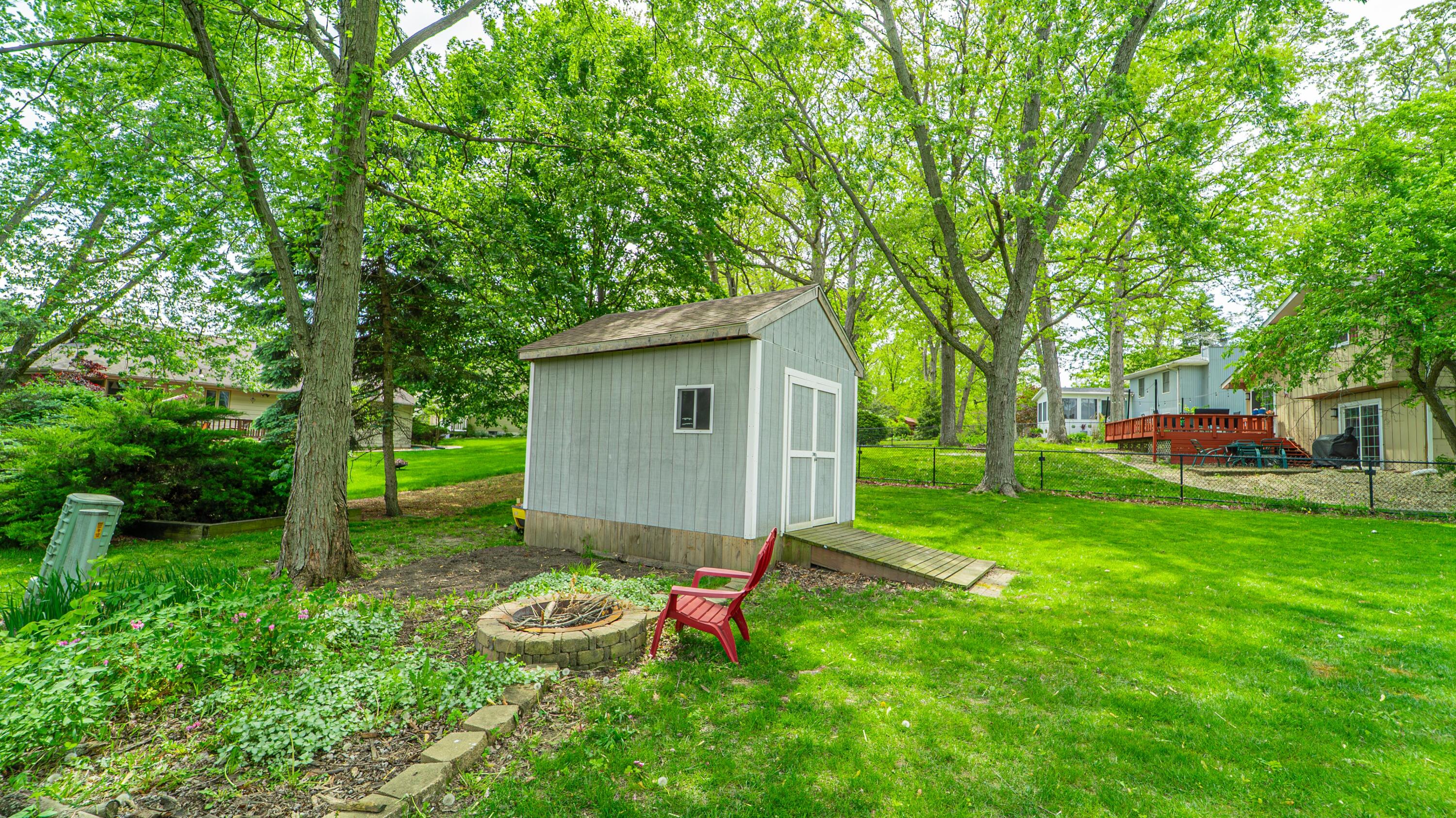 1980 Greenvalley Drive Crown Point, IN 46307 - Photo 37 of 45 a backyard of a house with plants and large trees