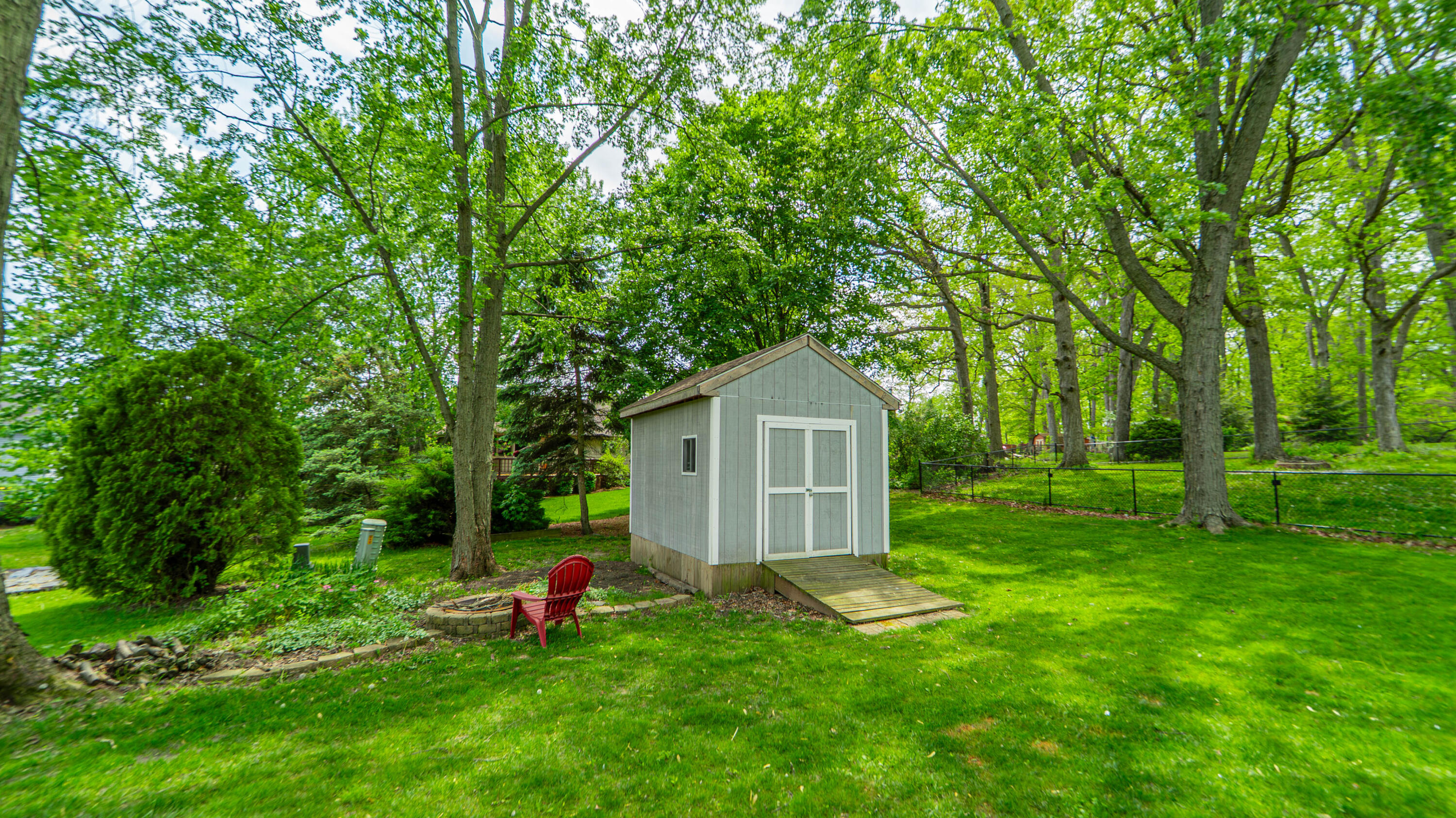 1980 Greenvalley Drive Crown Point, IN 46307 - Photo 41 of 45 a front view of a house with a yard and trees