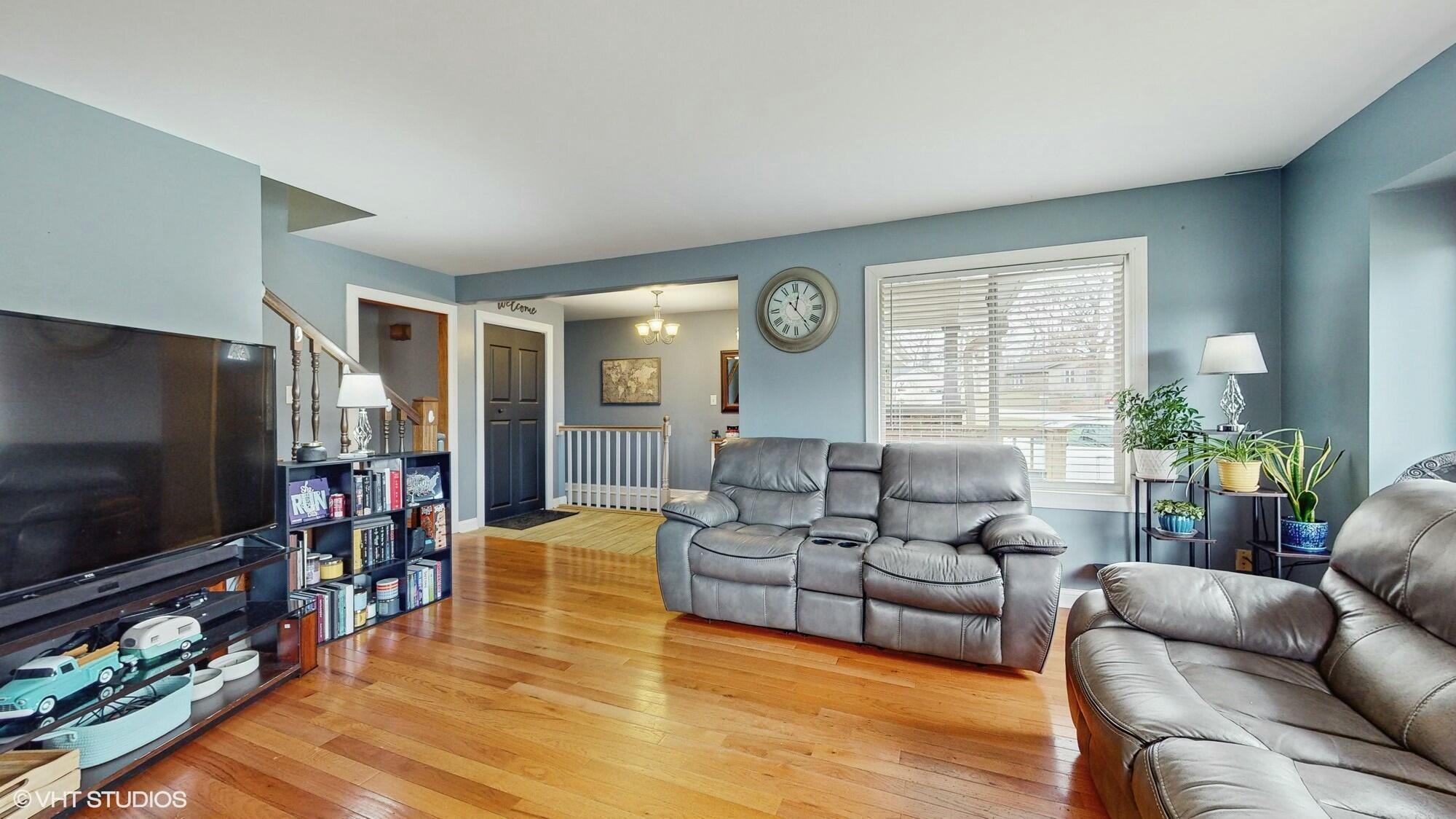 1980 Greenvalley Drive Crown Point, IN 46307 - Photo 7 of 45 a living room with furniture and a flat screen tv