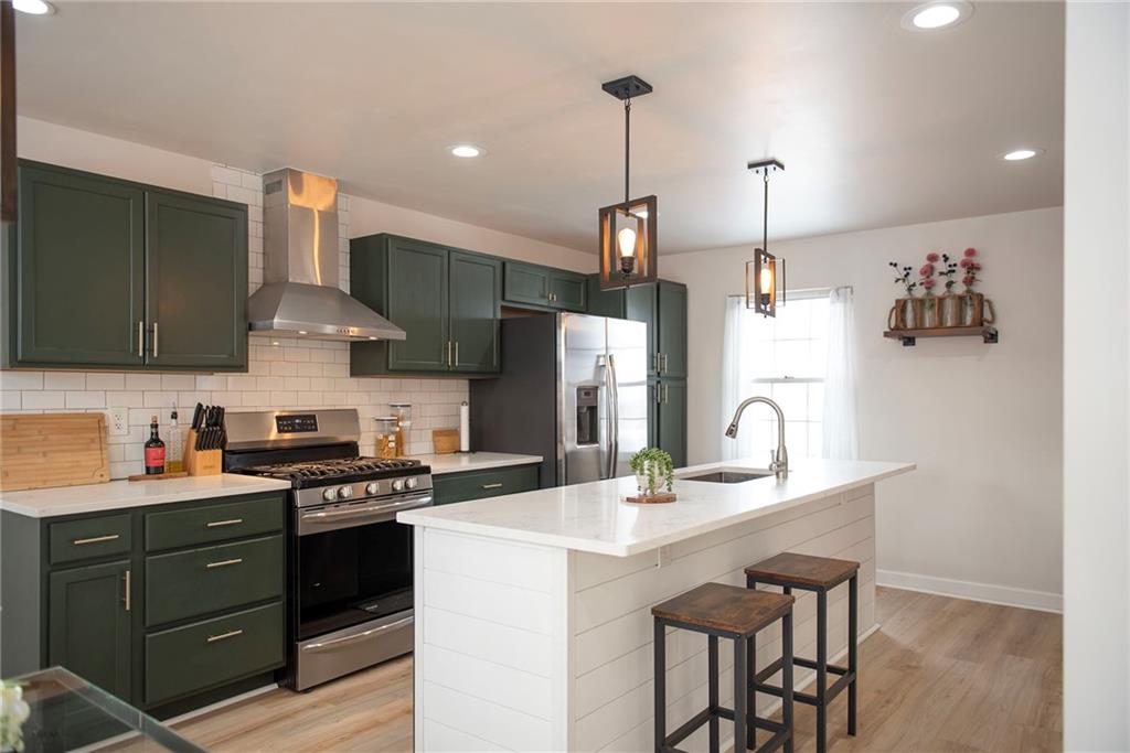 1315 Bower Hill Road Pittsburgh, PA 15243 - Photo 24 of 43 a kitchen with a sink stove and cabinets