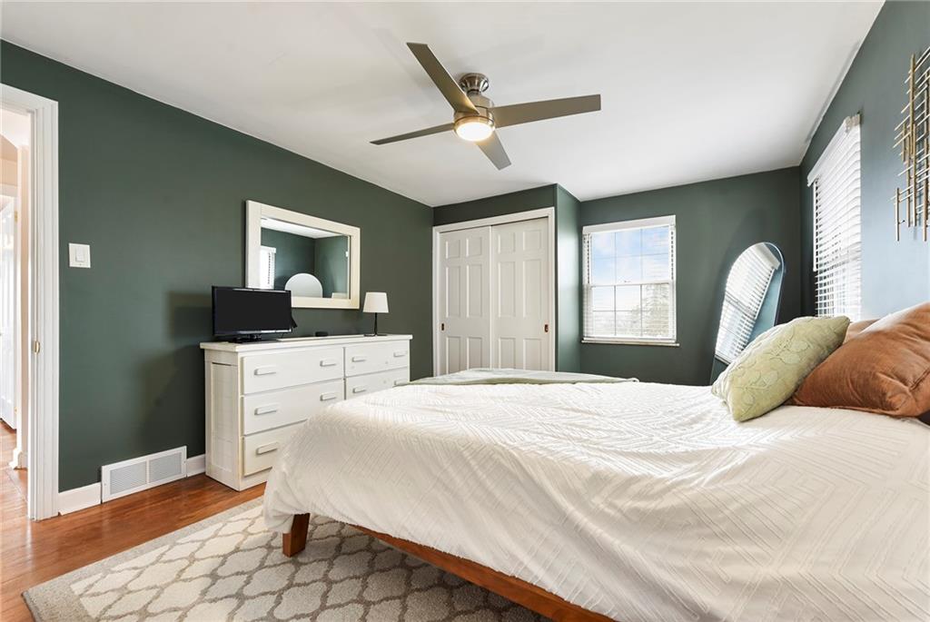 1315 Bower Hill Road Pittsburgh, PA 15243 - Photo 25 of 43 a bedroom with a large bed and a chandelier