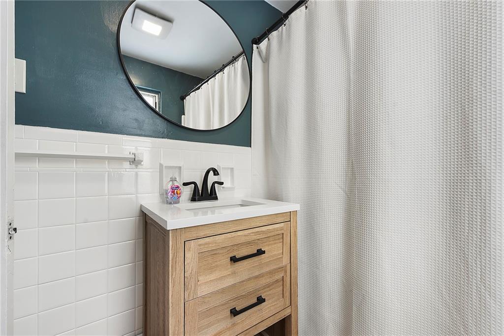 1315 Bower Hill Road Pittsburgh, PA 15243 - Photo 35 of 43 a bathroom with a sink and a mirror