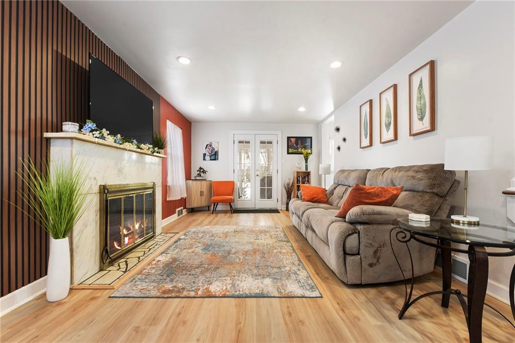 1315 Bower Hill Road Pittsburgh, PA 15243 - Photo 5 of 43 a living room with furniture a fireplace and a flat screen tv