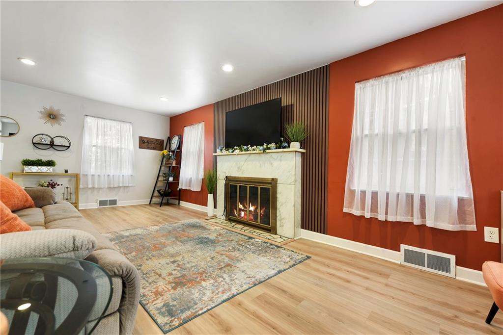 1315 Bower Hill Road Pittsburgh, PA 15243 - Photo 7 of 43 a living room with furniture a flat screen tv and a fireplace