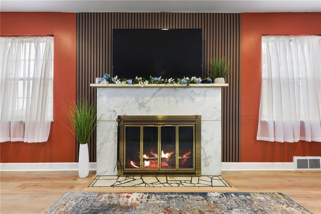 1315 Bower Hill Road Pittsburgh, PA 15243 - Photo 9 of 43 a fireplace with a table and a chair