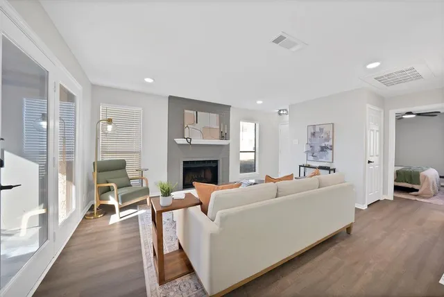 a living room with furniture and a fireplace