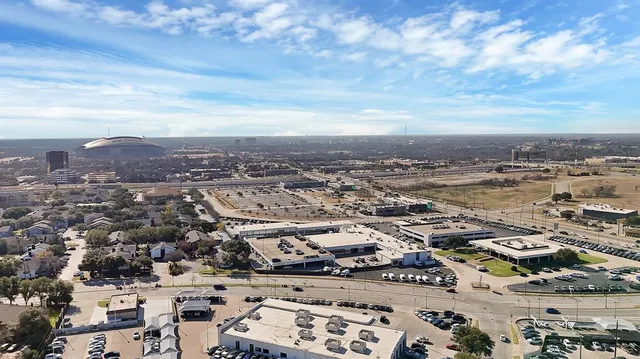 an aerial view of residential building with yard