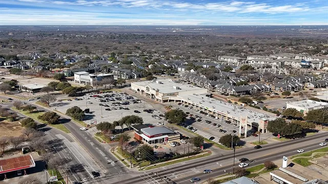 an aerial view of residential building and parking space