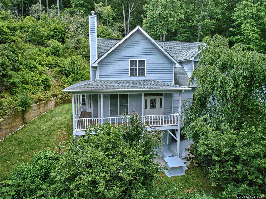 2322 Locust Grove Road Hendersonville, NC 28792 - Photo 1 of 40 a front view of house with a garden