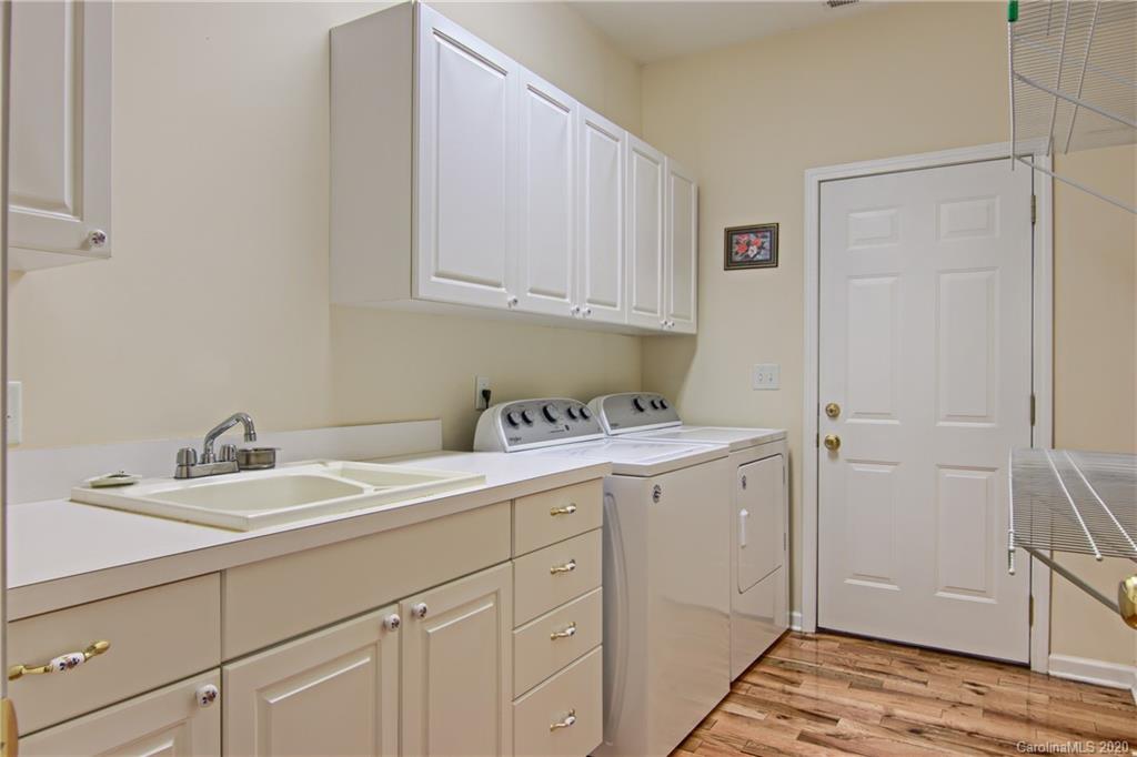 2322 Locust Grove Road Hendersonville, NC 28792 - Photo 17 of 40 a utility room with a sink