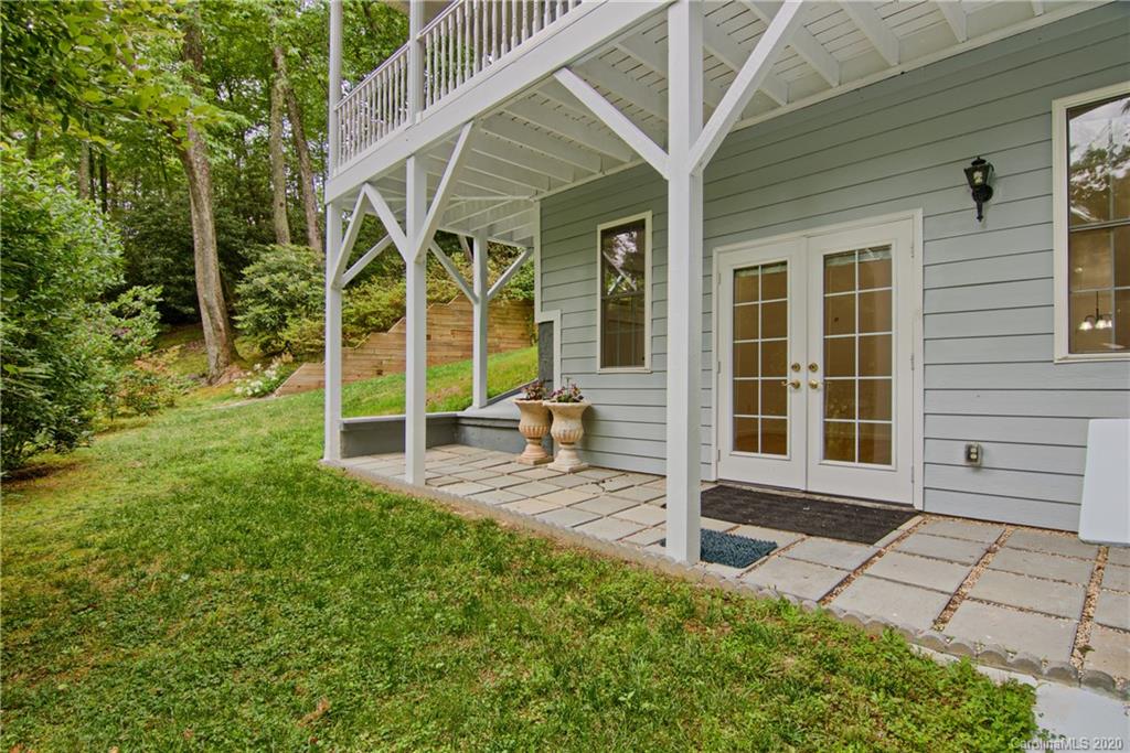 2322 Locust Grove Road Hendersonville, NC 28792 - Photo 3 of 40 a view of a house with backyard and porch