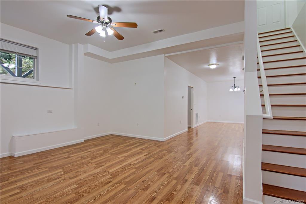 2322 Locust Grove Road Hendersonville, NC 28792 - Photo 27 of 40 a view of empty room with wooden floor