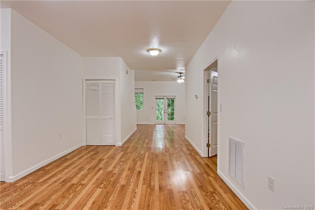 2322 Locust Grove Road Hendersonville, NC 28792 - Photo 29 of 40 a view of a hallway with wooden floor
