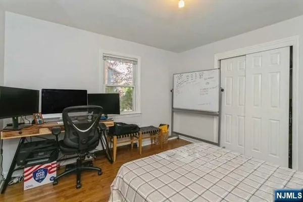 a bedroom with bed and a window