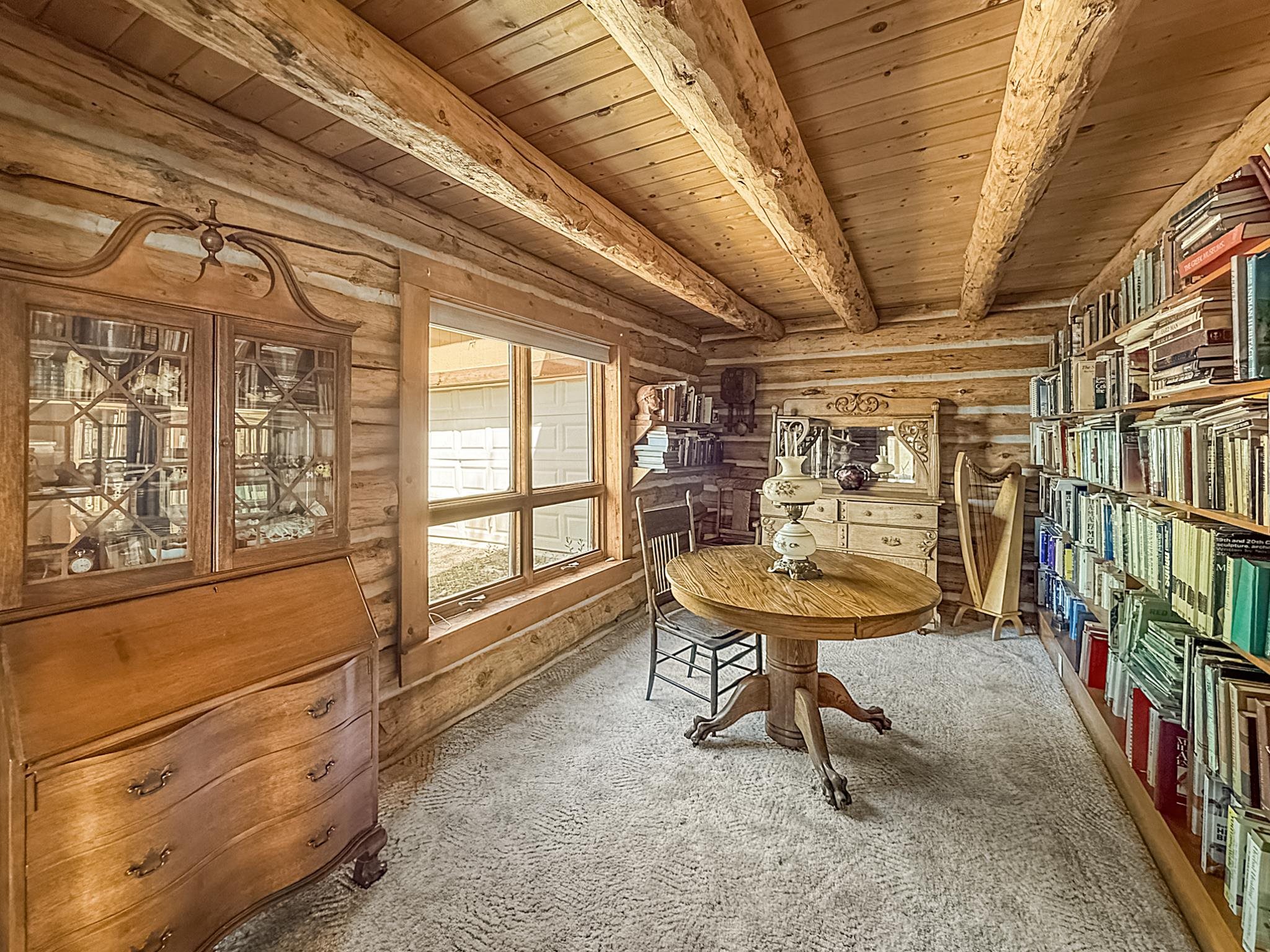 9709 3605 Road Hotchkiss, CO 81419 - Photo 26 of 42 a room with lots of furniture and a window