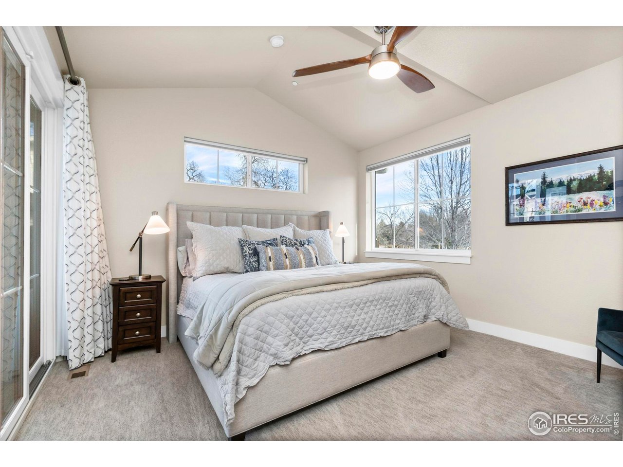 910 Hill Pond Road, Unit 15 Fort Collins, CO 80526 - Photo 11 of 43 a bedroom with a bed chandelier and a window