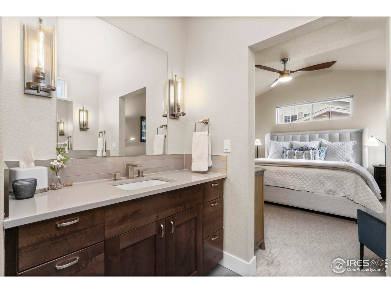 910 Hill Pond Road, Unit 15 Fort Collins, CO 80526 - Photo 13 of 43 a en suite bathroom with a double vanity sink double mirror and bathtub