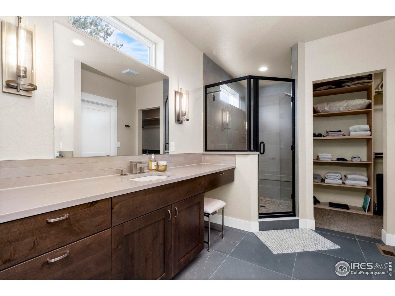910 Hill Pond Road, Unit 15 Fort Collins, CO 80526 - Photo 14 of 43 a bathroom with a sink a toilet and a large mirror